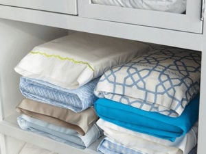 Folding organizing linens in pillowcase, bedroom organizing, Style Degree, Singapore, SG, StyleMag