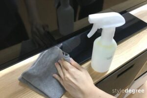 Wiping TV stand, Wiping TV stand with dusting spray, Style Degree, Singapore, SG, StyleMag.