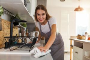 Woman cleaning kitchen, Woman wiping countertop, Style Degree, Singapore, SG, StyleMag.